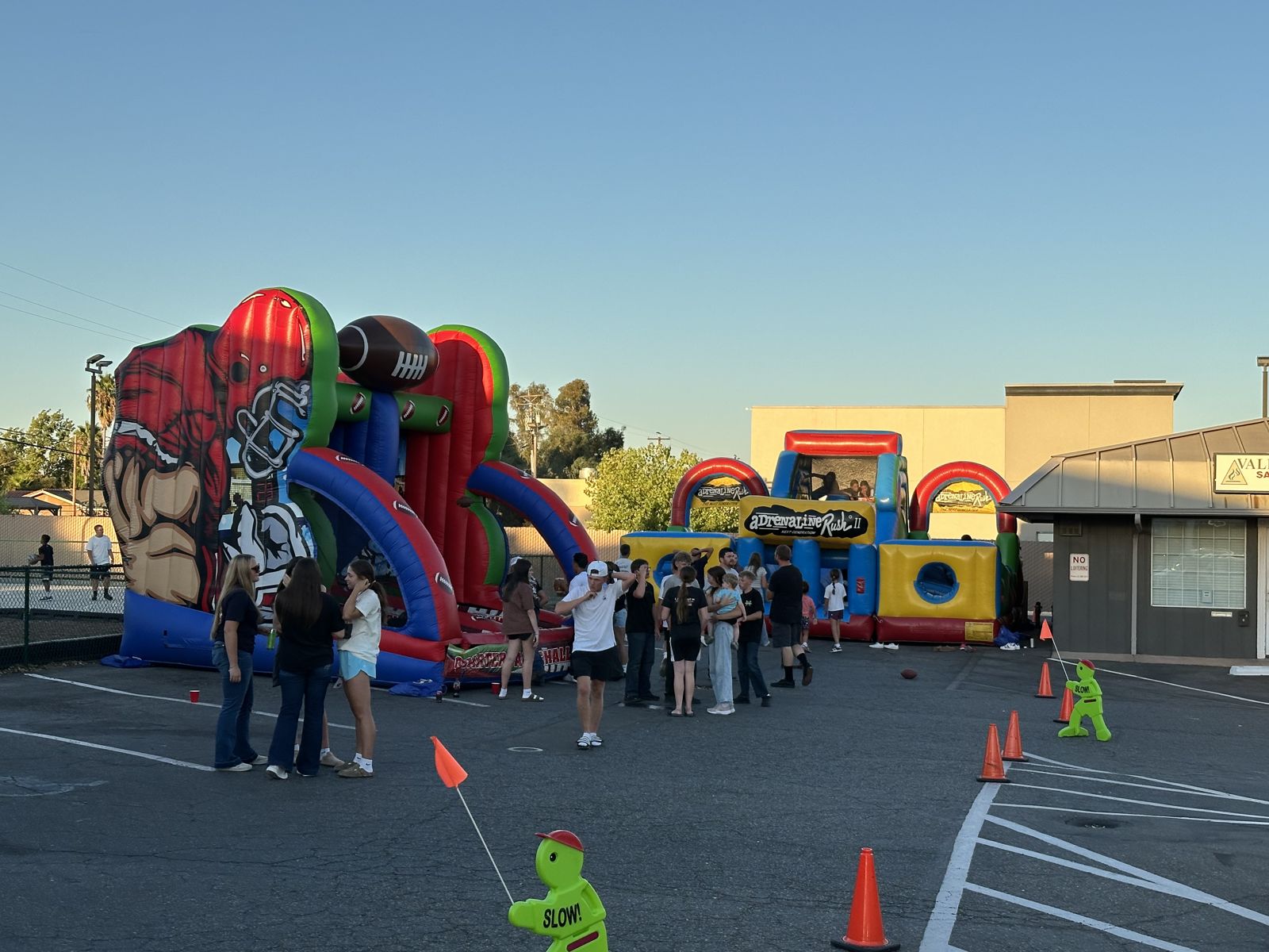 Students at a school carnival with inflatables