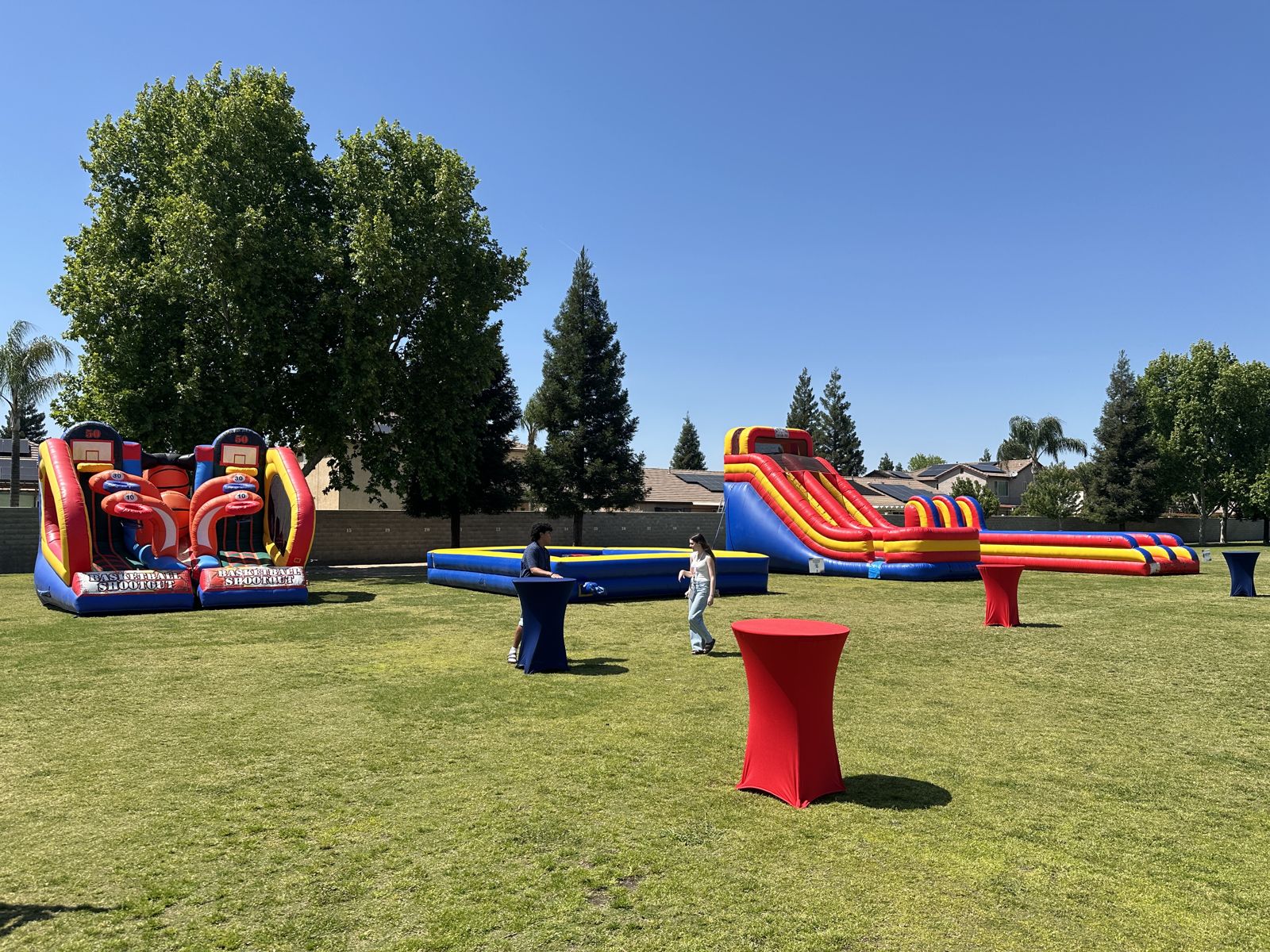 Multi-attraction inflatable setup in a park