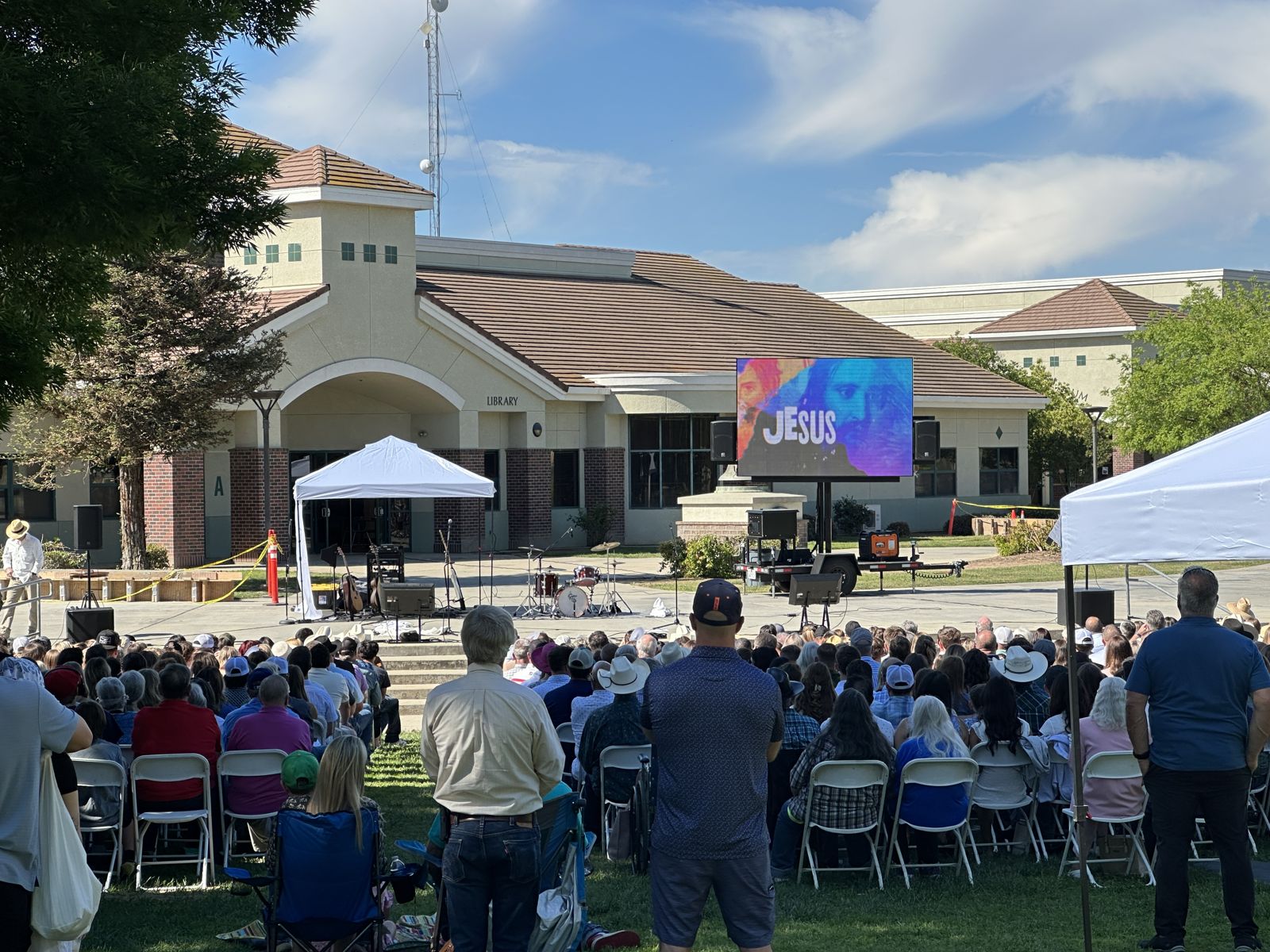Large outdoor church gathering with LED wall