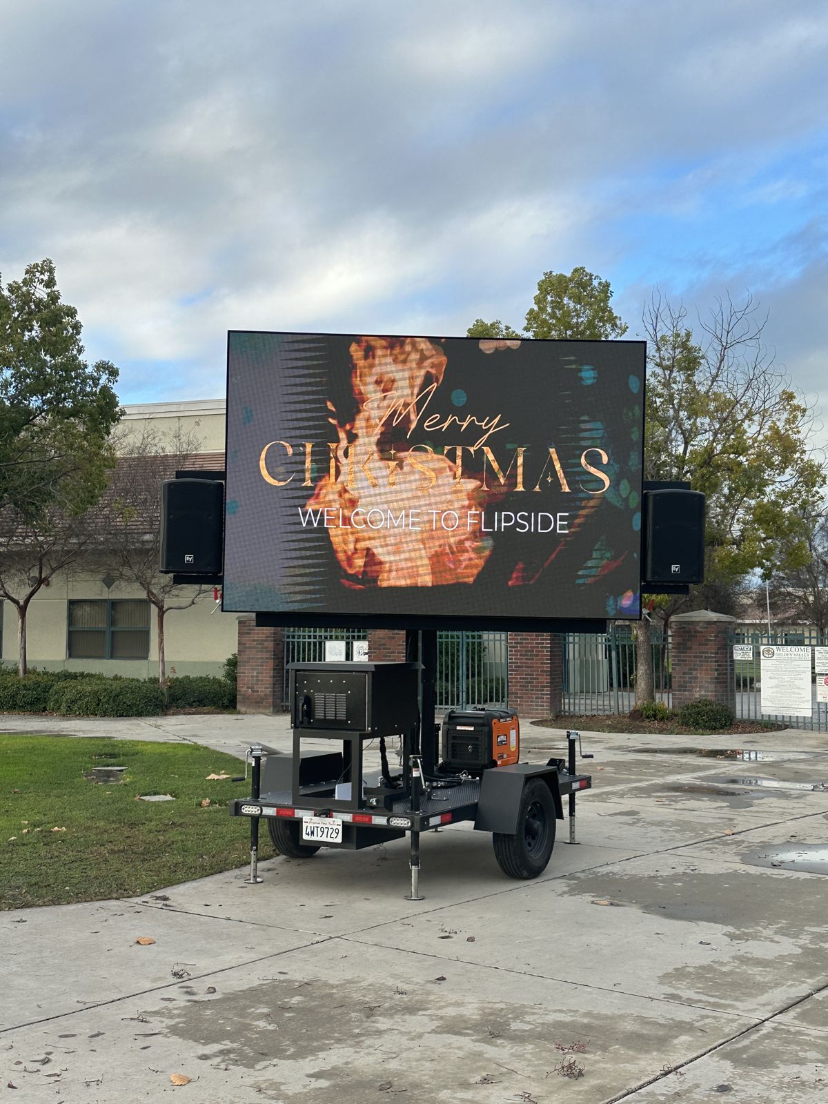 LED wall showing a Christmas event message